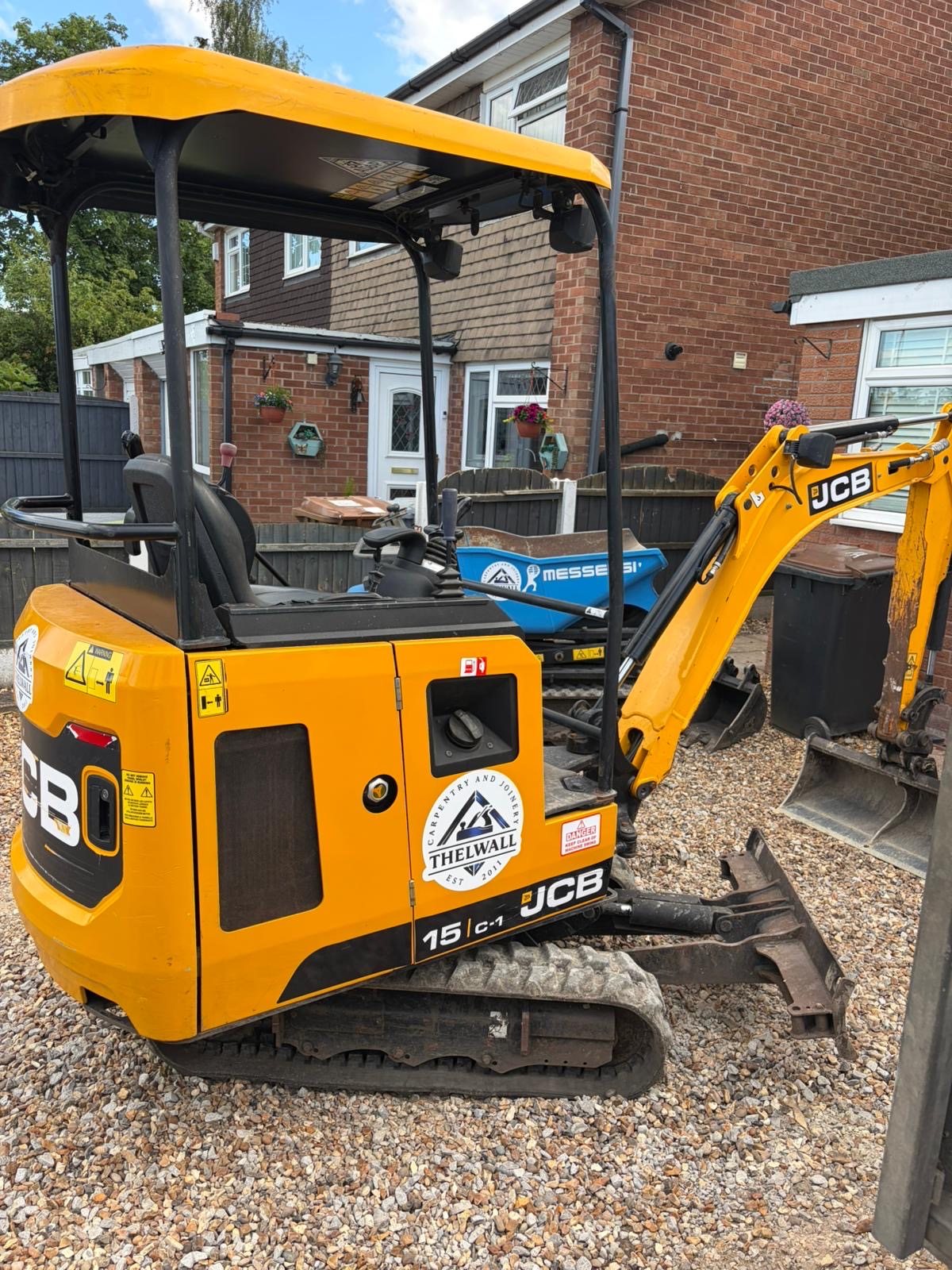 Thelwall's own tracked mini-digger on a prepared gravel site
