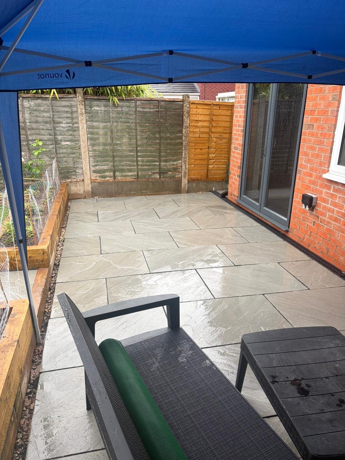 Newly laid Indian sandstone patio, left clean and finished